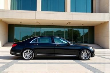 Luxury car parked in front of a building